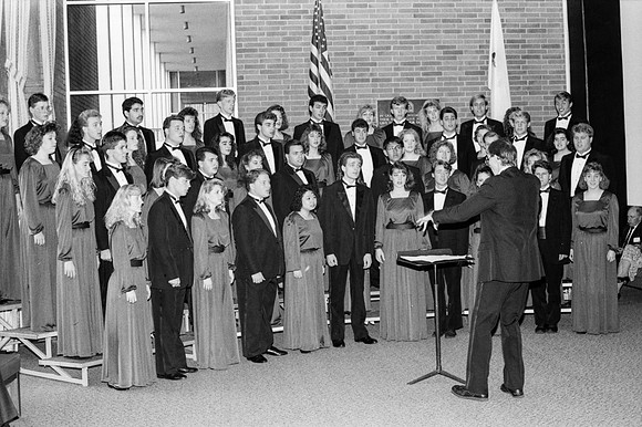 The choir sings a piece at the President's Club Banquet