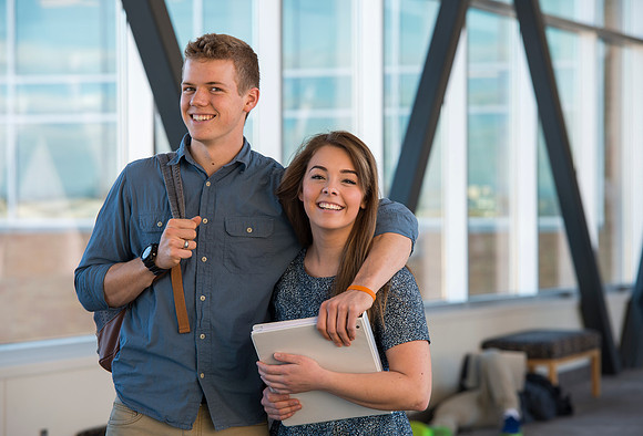 BYU-Idaho students, Collin and Martina in the Skywalk between the Manwaring Center and the McKay Library.