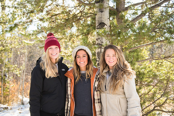 Cynthia Leal, Katelyn Crompton and Catie Simons pose out at the ropes course during iGrow at Badger Creek.