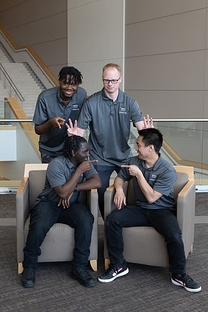 Students who are a part of the Campus Life organization take group photos.