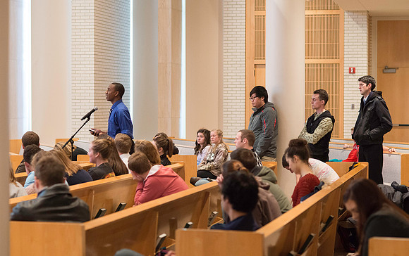 President Gilbert listens and answers questions from students during a Q&A.