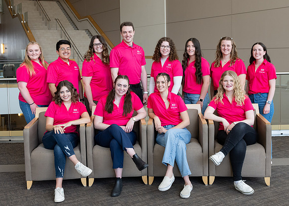 Students who are a part of the Campus Life organization take group photos.