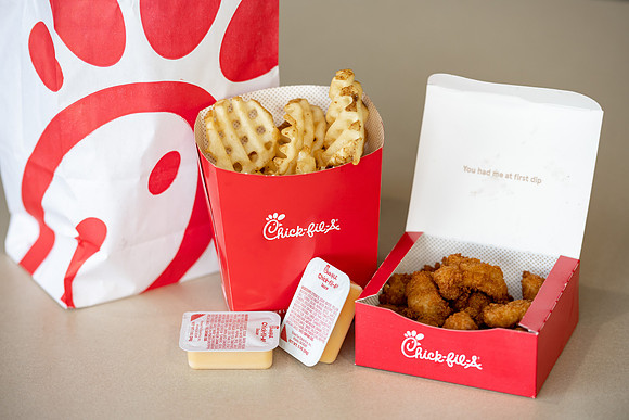 Employees of the Chick-Fil-A on the BYU-Idaho campus working and helping students.