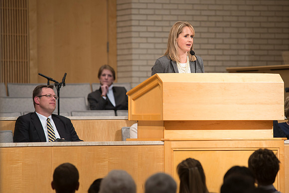 Sister GIlbert introduces Sister Bednar in A Gathering for Women in the Taylor Chapel.