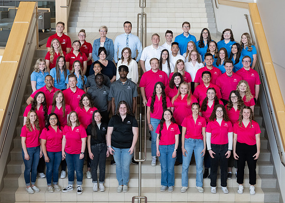 Students who are a part of the Campus Life organization take group photos.