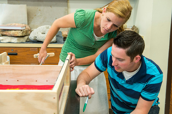 Nicole Rider, Jon Schmidt and Ryan Ronson work together on a Structural Geology Lab assignment: Analog modeling of thrust faults and compression.