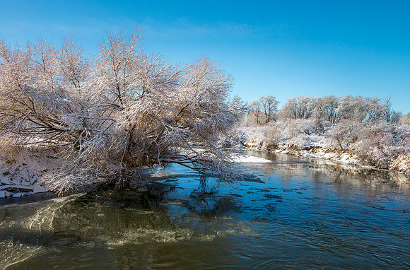 Winter scene of Teton River from bridge West of Rexburg on 3000 West.