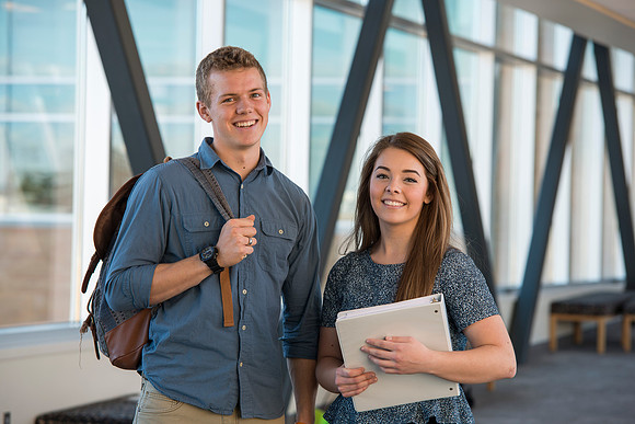 BYU-Idaho students, Collin and Martina in the Skywalk between the Manwaring Center and the McKay Library.