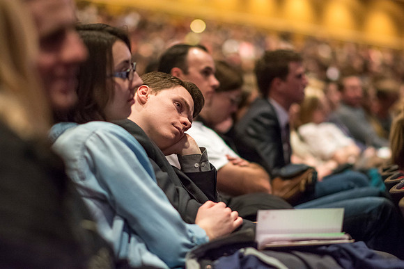 Students listen and take notes during devotional.