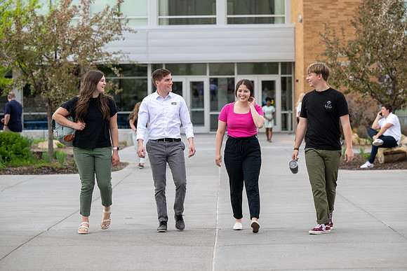 Student models for Admissions Viewbook cover options. May 2023