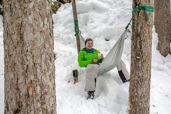 David Butler relaxes on a hammock and enjoys his lunch.