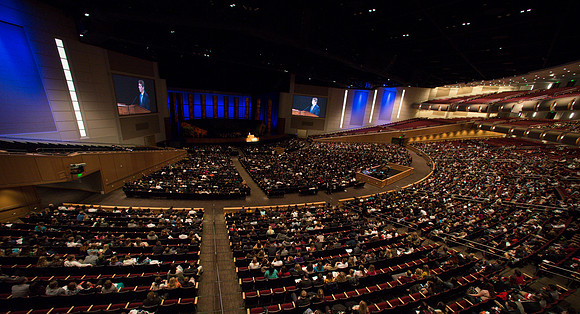 Students listen to Randal L. Ridd and take notes during the World Wide Devotional.