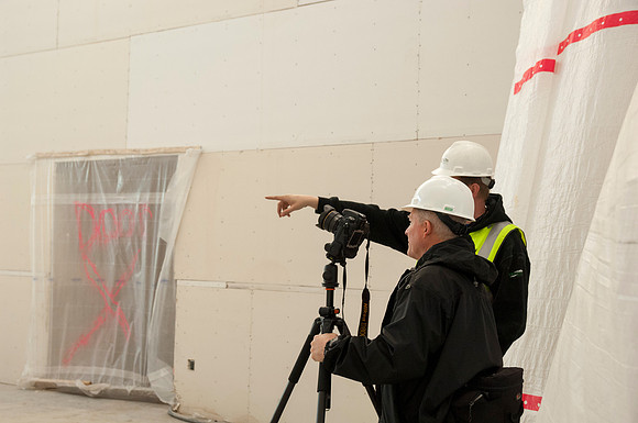 Mike Lewis, head of University Relations Photography, take pictures inside the new Science Technology Building.