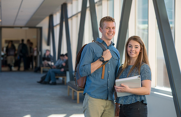BYU-Idaho students, Collin and Martina in the Skywalk between the Manwaring Center and the McKay Library.