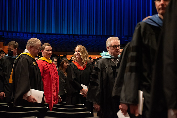 Student Graduates and Faculty meet in the I-Center for Commencement.