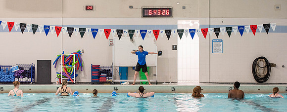 Students workout together in the pool at the Hart Building. Water Areobics Class taught by an instructor.