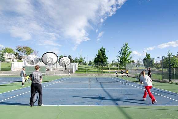 Students practicing at the Tennis Courts
