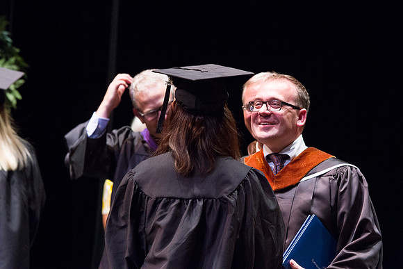 Dean's of the College of Performing and Visual Arts award diplomas to graduates during convocation held in the Snow Building.