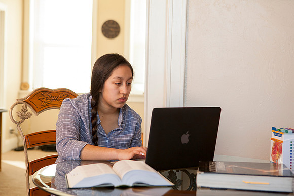Tanya Rickenbach studies online at BYU-Idaho in her quiet apartment.