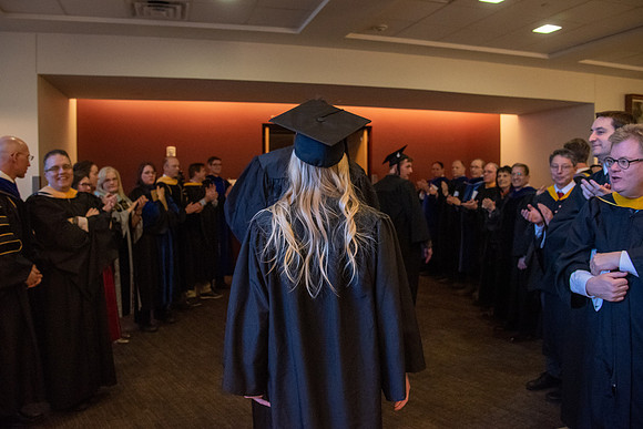 Student Graduates and Faculty meet in the I-Center for Commencement.