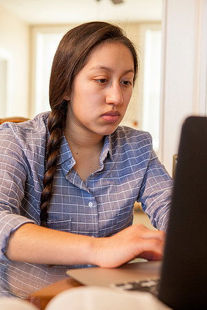 Tanya Rickenbach studies online at BYU-Idaho in her quiet apartment.