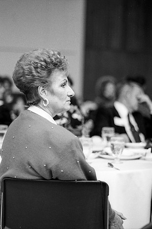 Members of the audience listen to the quartet sing a number