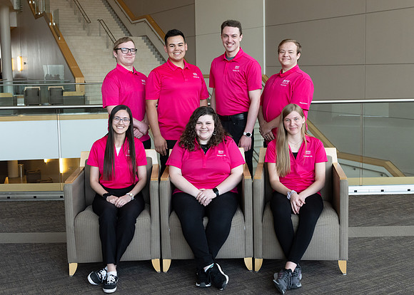 Students who are a part of the Campus Life organization take group photos.