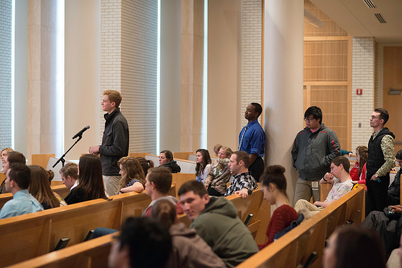 President Gilbert listens and answers questions from students during a Q&A.