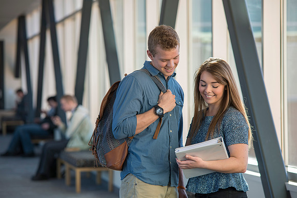 BYU-Idaho students, Collin and Martina in the Skywalk between the Manwaring Center and the McKay Library.