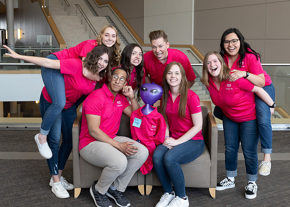 Students who are a part of the Campus Life organization take group photos.
