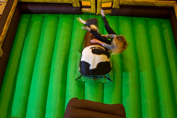 Students ride the bull as part of the festivities during I-Night.