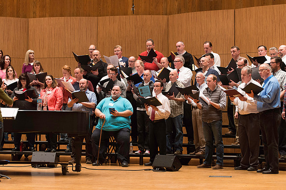 Ricks College Alumni from 1965 to 1995 gather for an A Cappella Choir reunion.