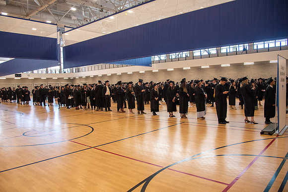 Student Graduates and Faculty meet in the I-Center for Commencement.