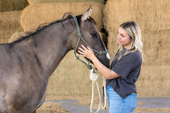 Rilie Vanderwiel, studying Animal Science, is right at home at the BYU-Idaho Animal Science Center.