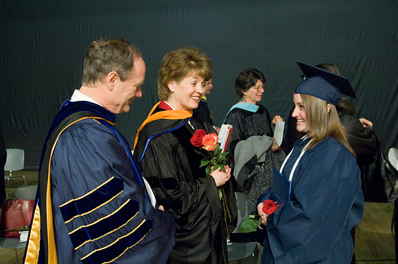Kassie Burton a Nursing graduate from Muscatine, Iowa greets Br. &amp; Sis Tanner after the colege of Agriculture and Life Sciences Convocation.
