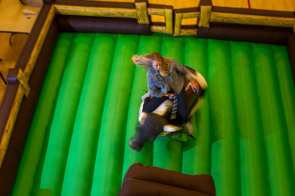 Students ride the bull as part of the festivities during I-Night.