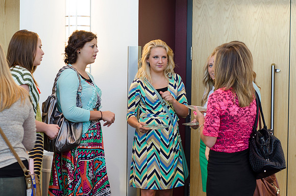 Participants chatting at the reception before the webcast