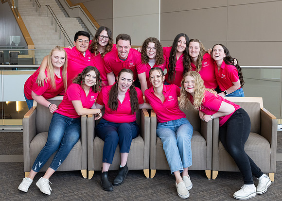 Students who are a part of the Campus Life organization take group photos.