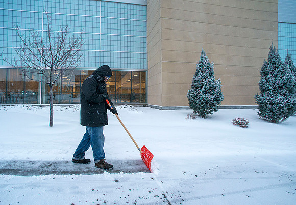 Lot Pena is one of many who start their day earlier then most to clear the sidewalks of snow.