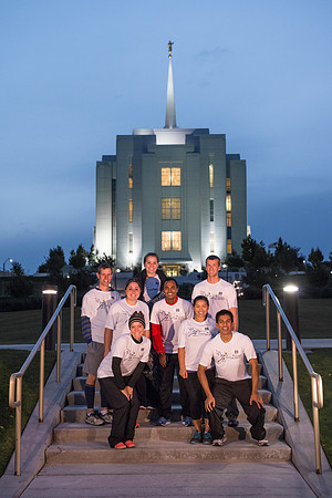 Team members pose by the Rexburg temple before they begin the temple to temple run