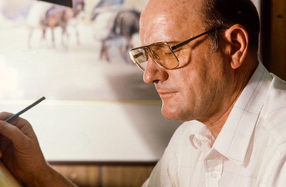 Graphic Artist, Dick Bird, works on an original piece. Illustration for President Joe J. Christensen.