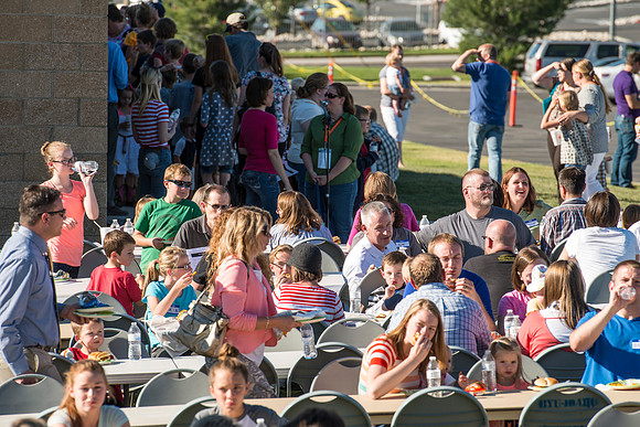 Faculty and their families, as part of the Online Learning & Teaching Conference, join together for dinner and games.
