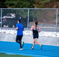 Faculty and community members of BYUI at Speed and Agility triathlete trannings at the stadium.