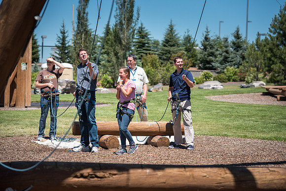 Online Instructors come to BYU-Idaho campus for further learning to enhance teaching skills. Instructors take their turn at the Ropes Course.