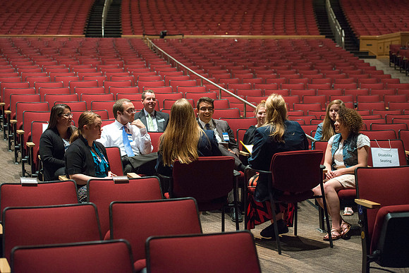 Student ushers play an important role at devotionals. Before they take their places to assist others they have a prayer meeting to prepare them for their service.