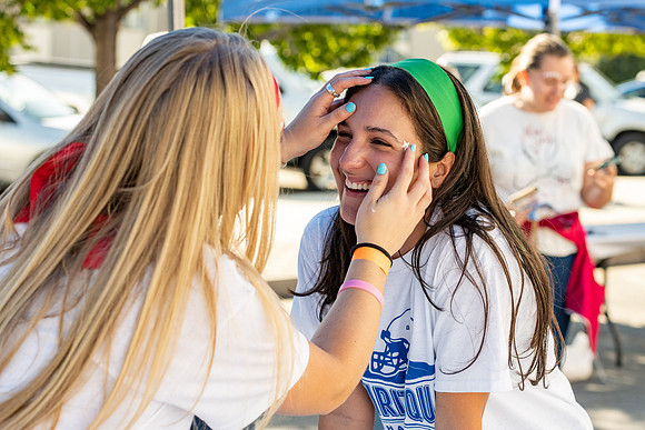 Students gather at the stadium to watch the football championship.