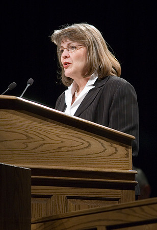 Sister Sue Clark speaking at a devotional.