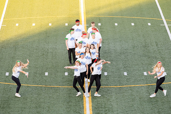 Students gather at the stadium to watch the football championship.