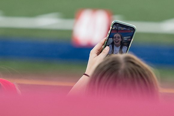 Students gather at the stadium to watch the football championship.