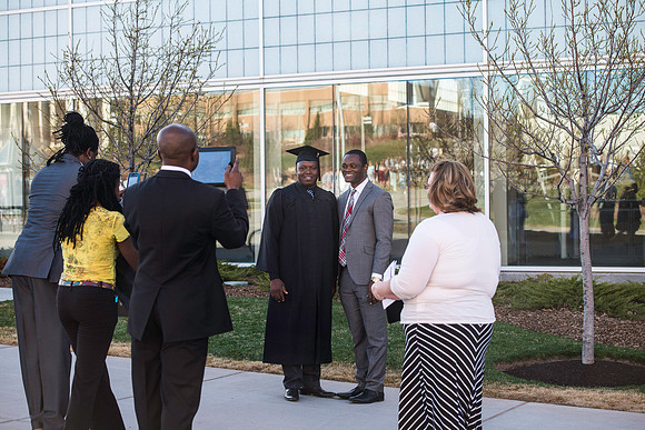 Students gather in their cap and gowns for graduation from BYU-Idaho April 6, 2016.